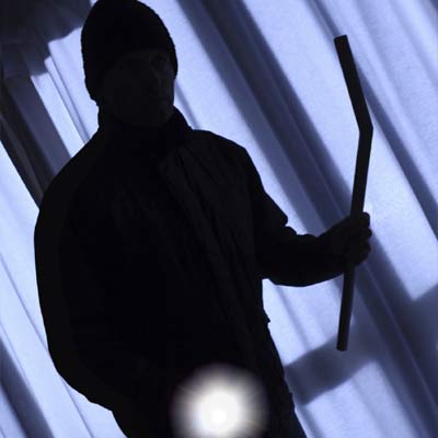 shadow man with flashlight